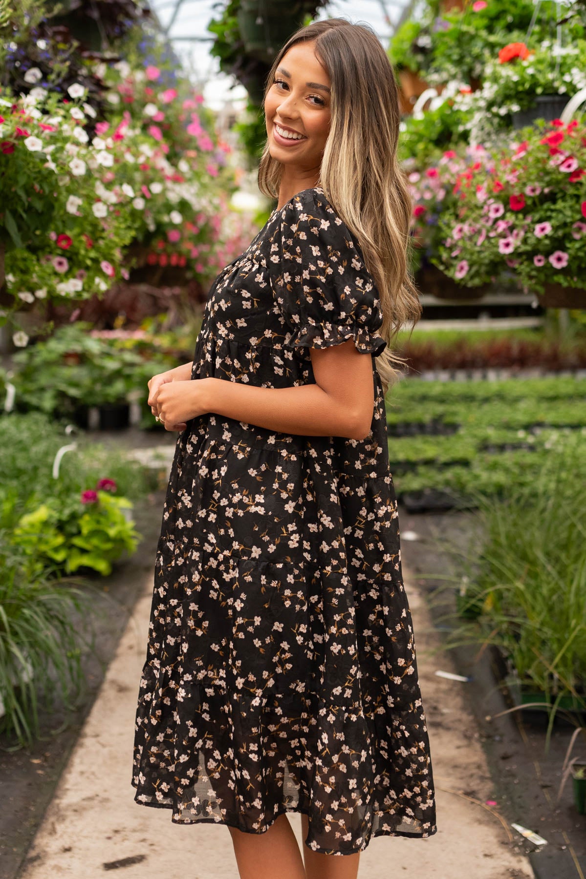 Side view of the black floral midi dress