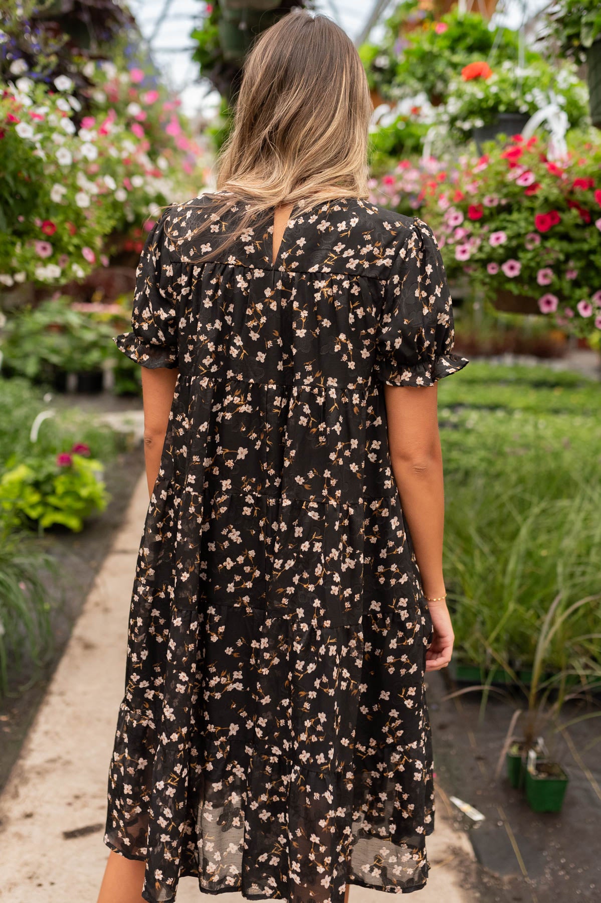 Back view of the black floral midi dress