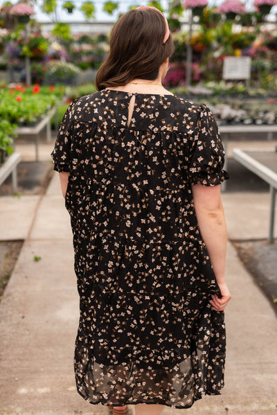 Back view of the plus size black floral midi dress