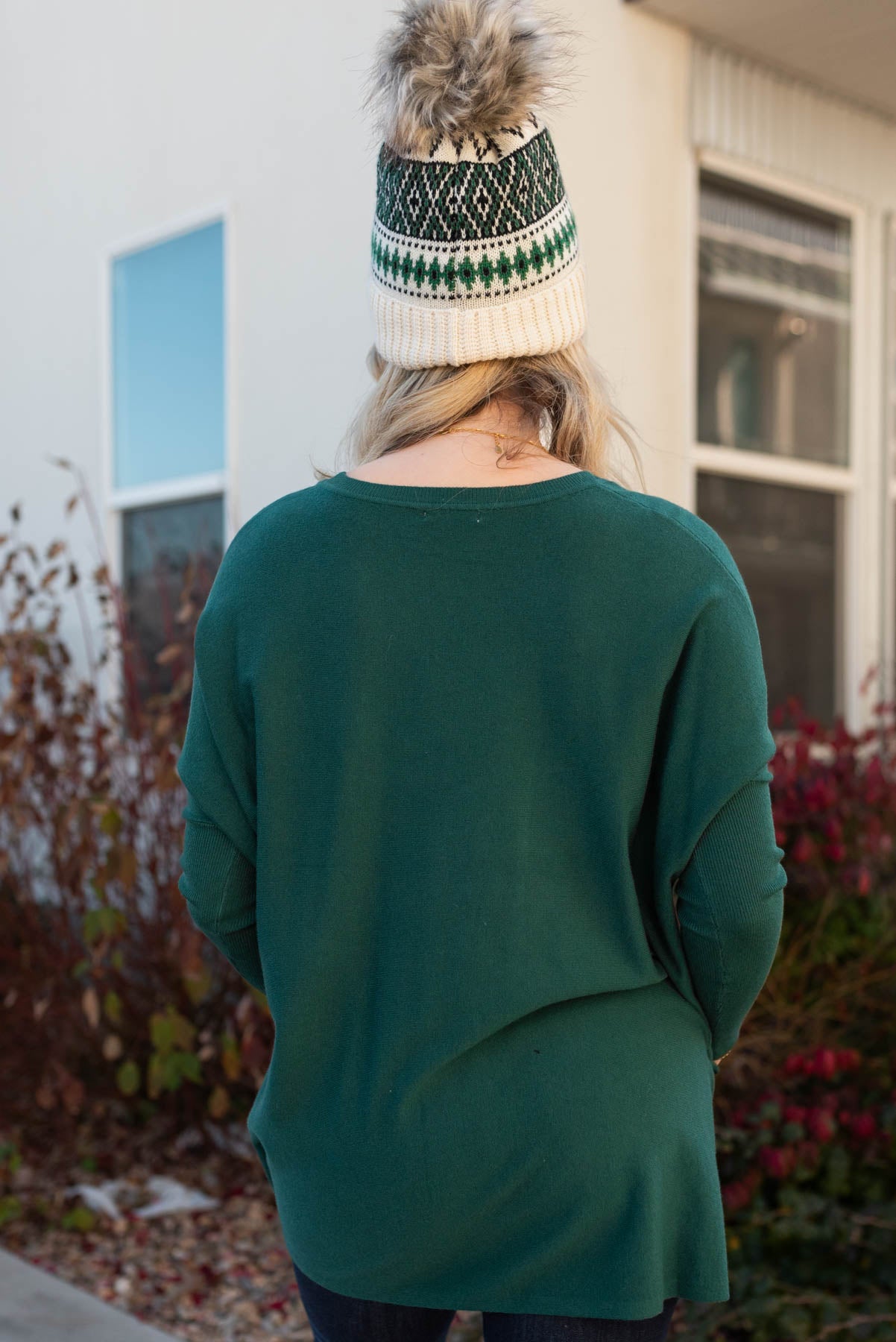 Back view of the hunter green pocket sweater