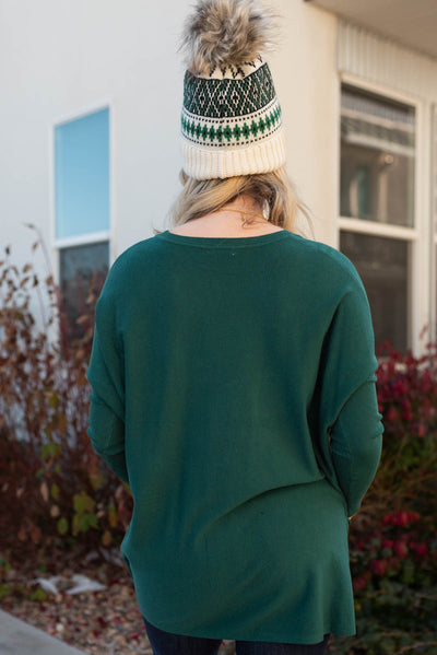 Back view of the hunter green pocket sweater
