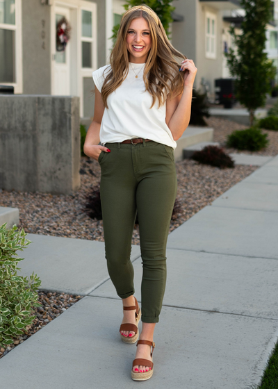Short sleeve white top with olive pants that are sold separately