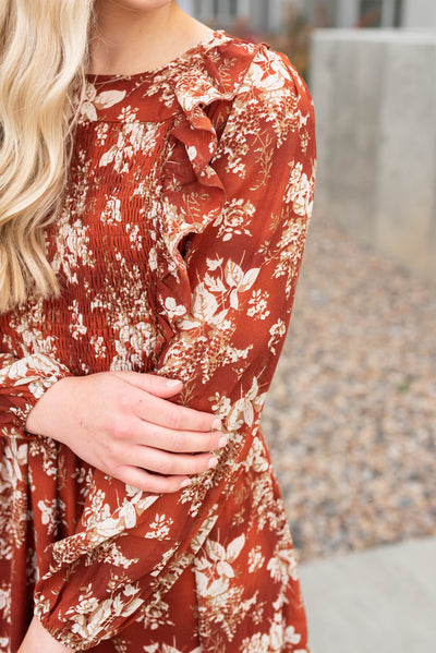 Rust floral maxi dress with ruffle on the sleeve and smocked bodice