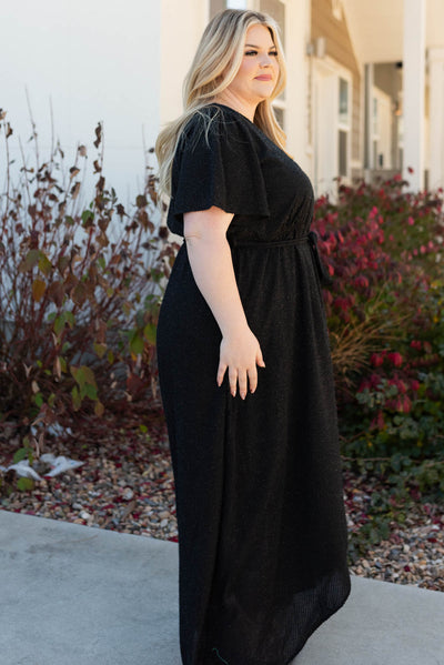 Side view of the plus size sparkle maxi wrap dress