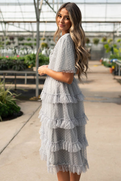 Side view of the grey blue ruffle dress