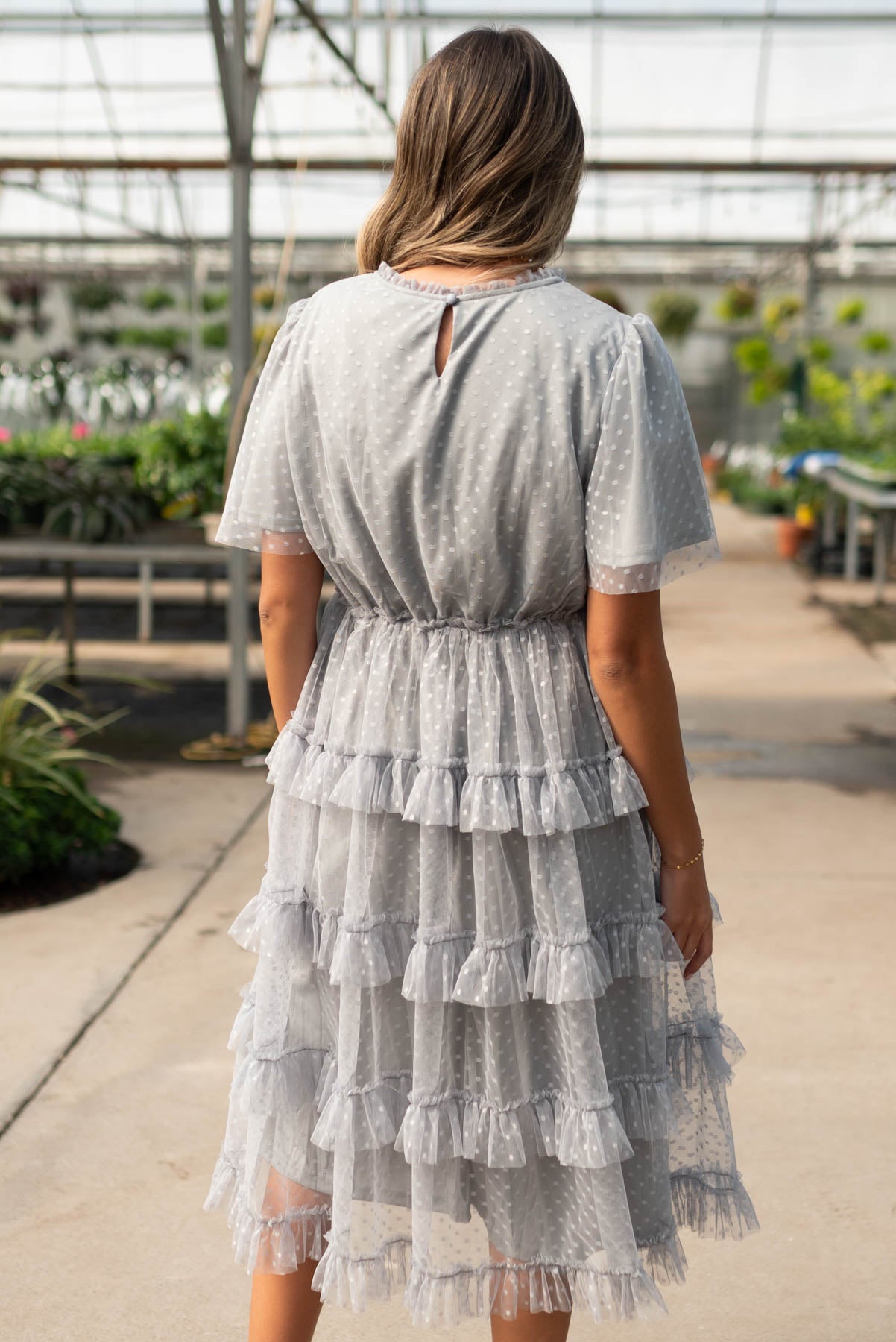 Back view of the grey blue ruffle dress