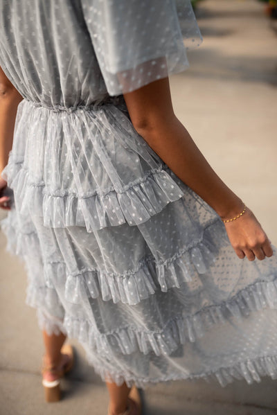 Close up of the fabric and ruffles on the grey blue ruffle dress