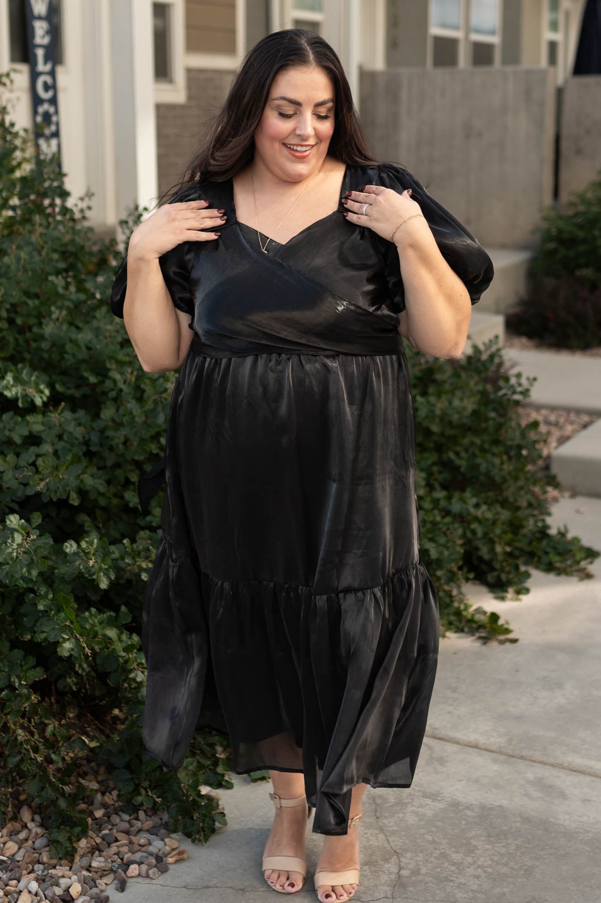 Plus size black dress with a sweetheart neck and ties at the back