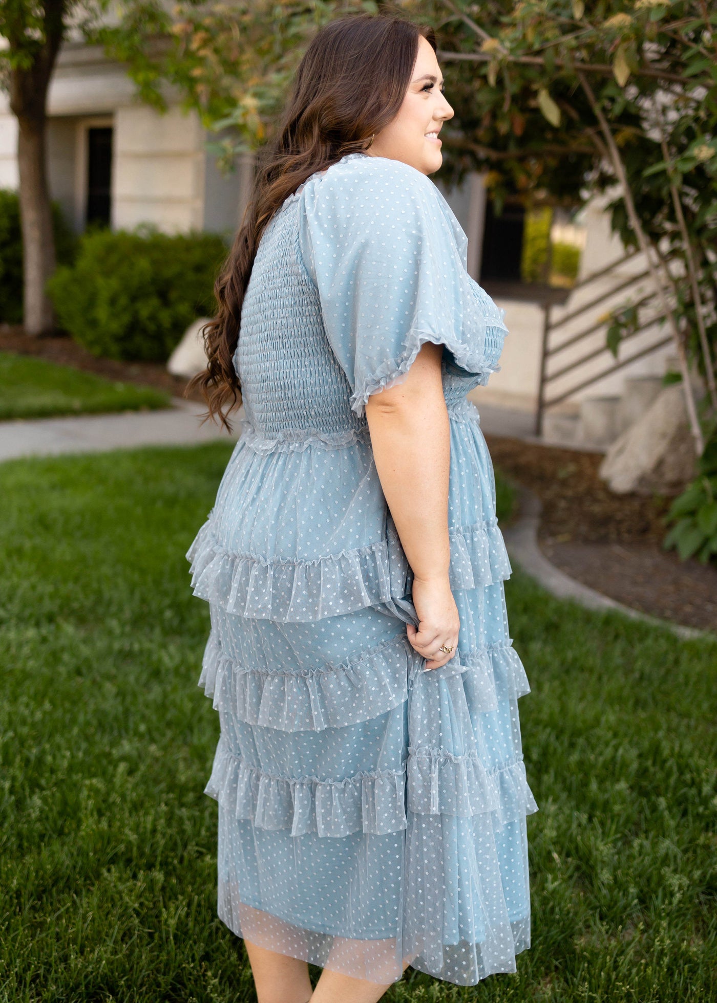 Side view of a short sleeve dusty blue dress