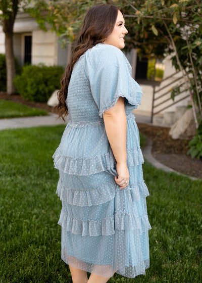 Side view of a short sleeve dusty blue dress