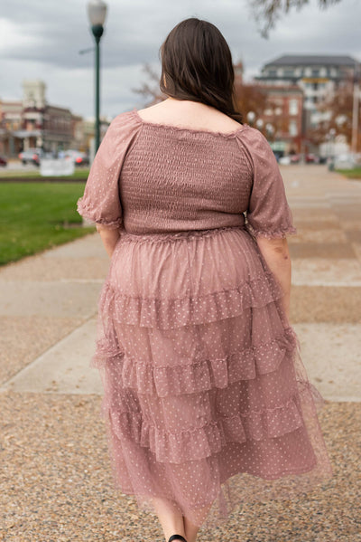 Back view of the plus size dusty rose dress with elastic smocking on the bodice