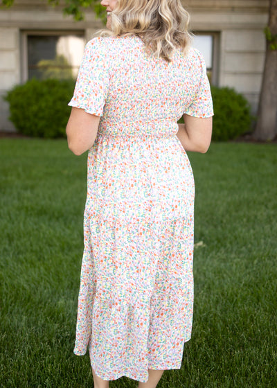Back view of a coral floral dress