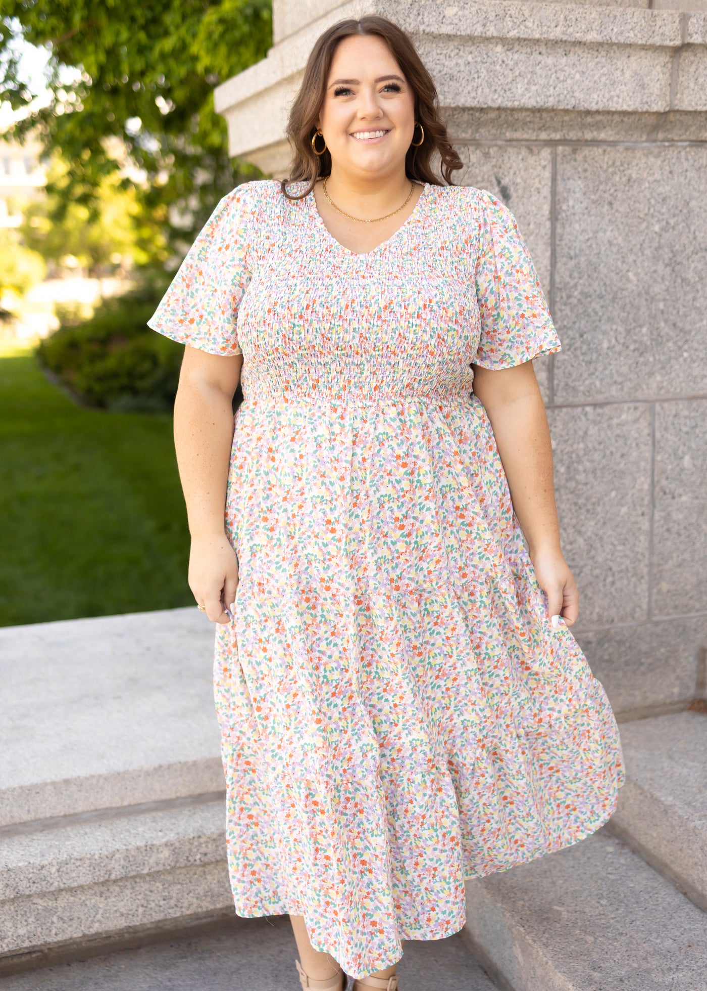 Plus size coral floral dress with smocked bodice