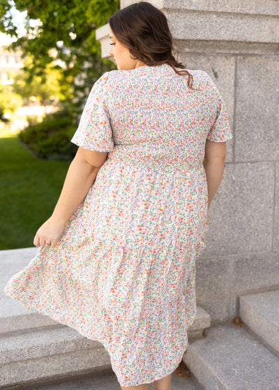 Back view of a plus size short sleeve coral floral dress