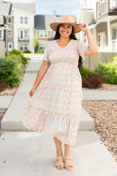 Short sleeve coral floral dress with smocked bodice
