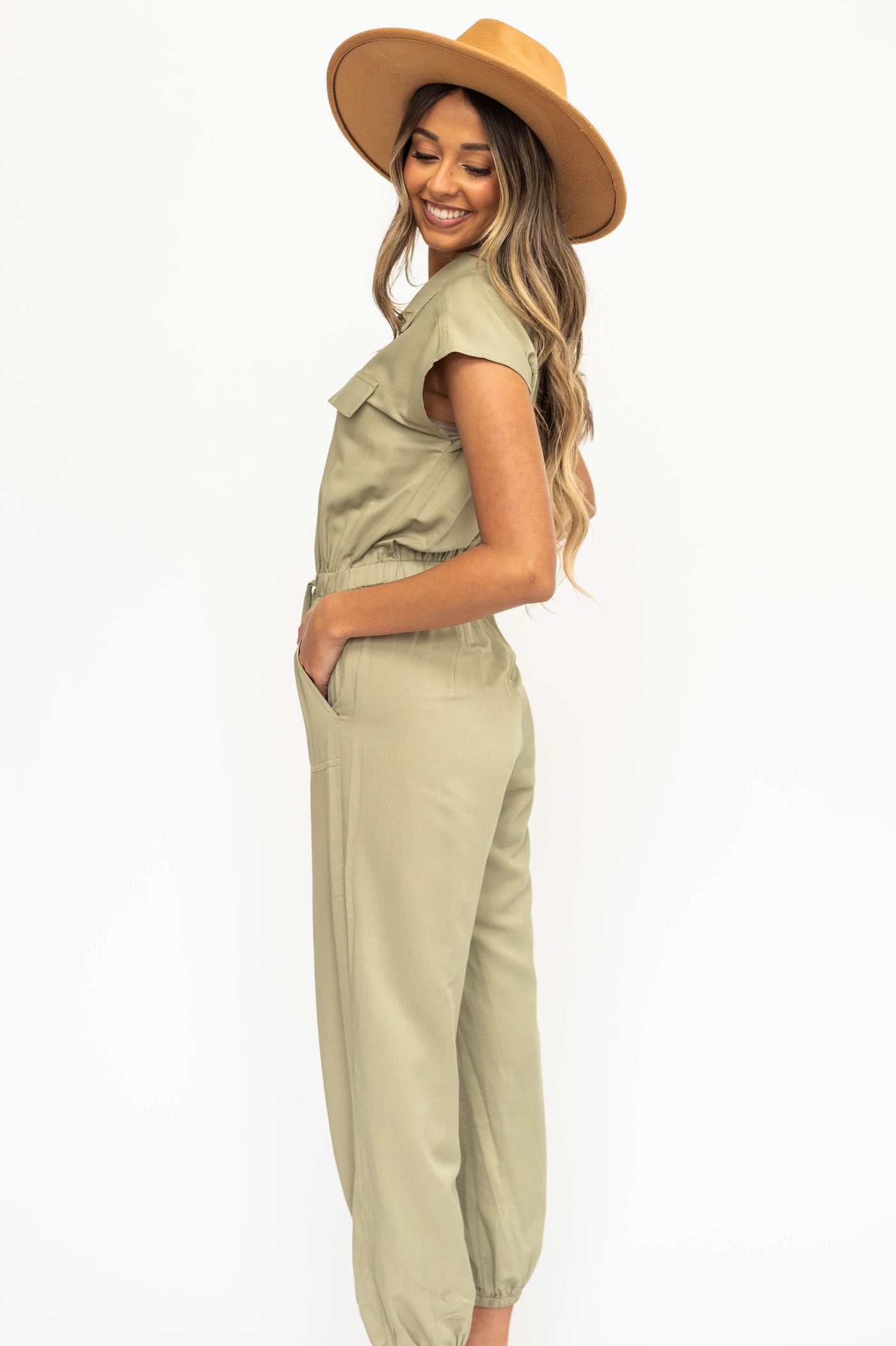 Side view of a olive jumpsuit