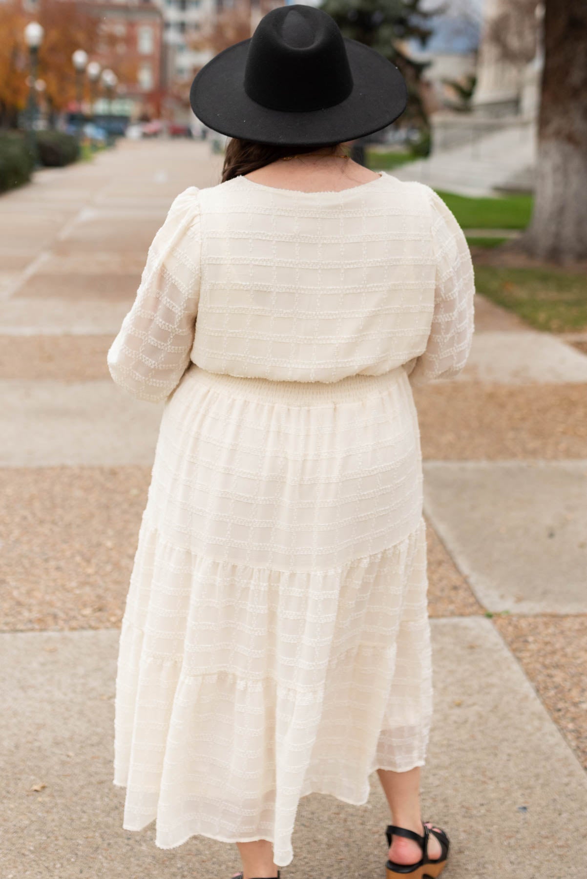 Plus size back view of cream glitter maxi dress