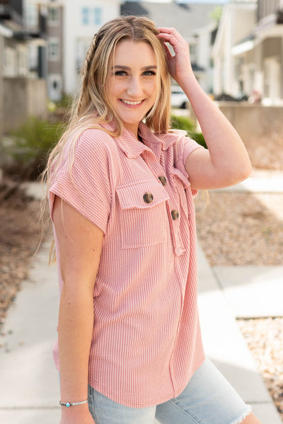 Side view of the mauve button down top