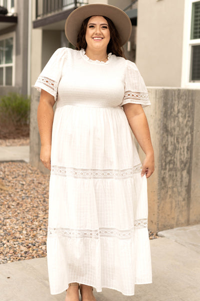 Front view of a long white dress with lace detail