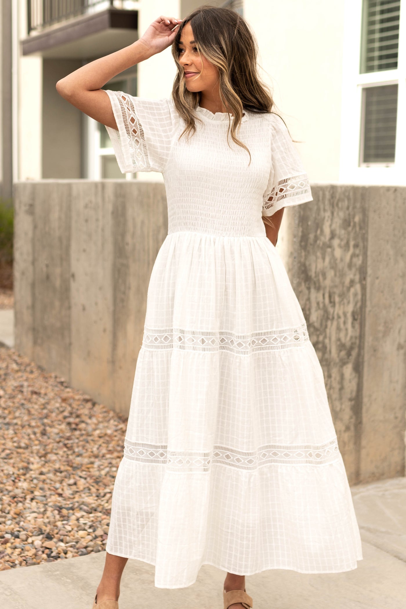 Front view of a white dress with lace detail