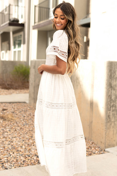 Side view of a white dress with lace detail