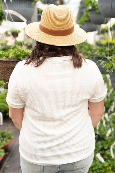 Back view of the plus size white ribbed knit top