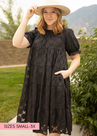 Tiered black dress with short sleeves