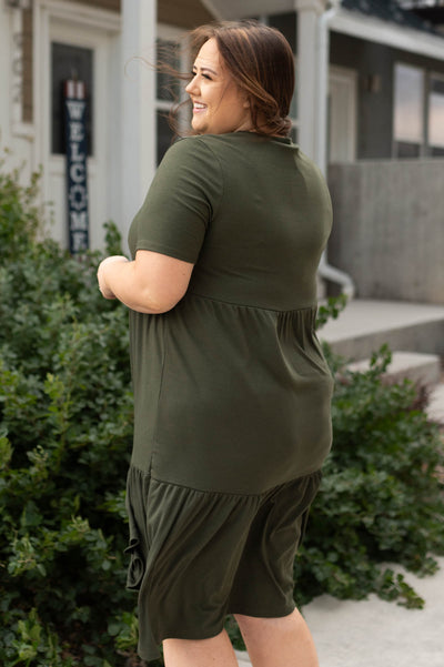 Side view of a plus size olive dress