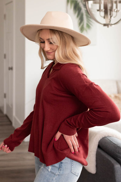 Side view of the long sleeve burgundy top