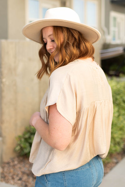 Side view of a medium beige top