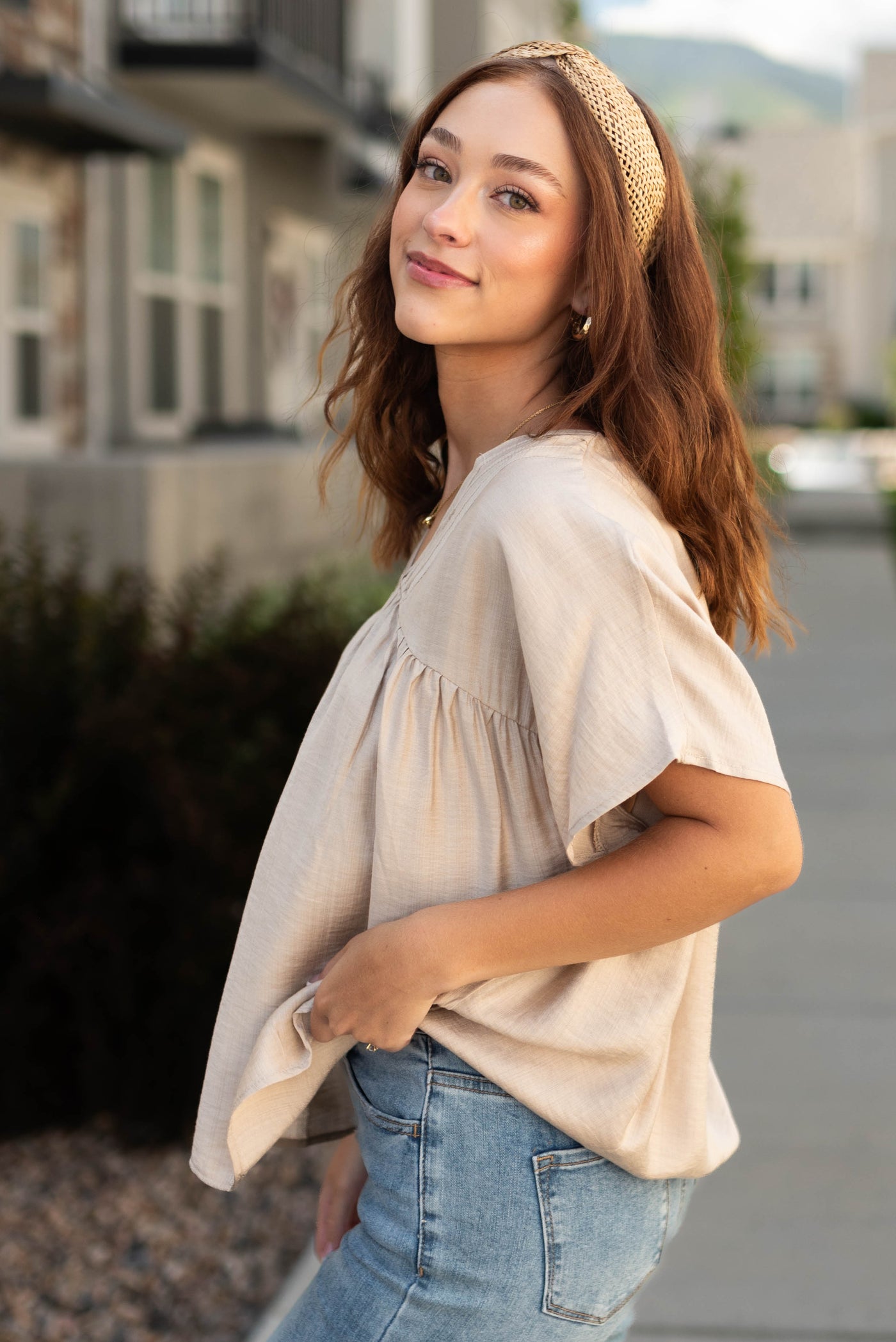 Side view of a beige top