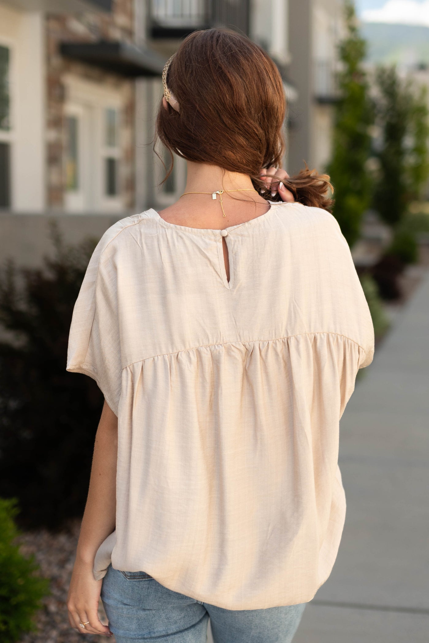 Back view of a beige top