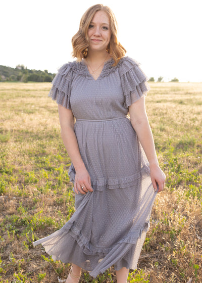 Blue gray dress with ruffles at the neck and on the sleeves