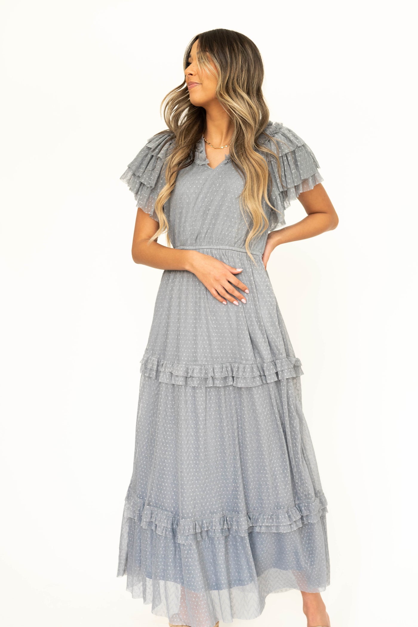 Blue gray lace short sleeve dress with ruffles on sleeves and neck.