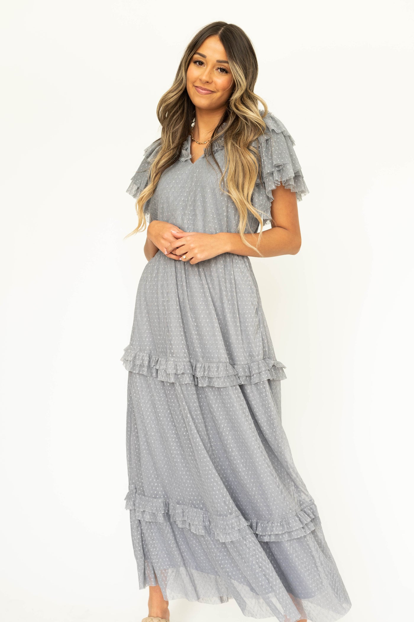blue gray lace short sleeve dress with pockets, ruffles on sleeves and neck.