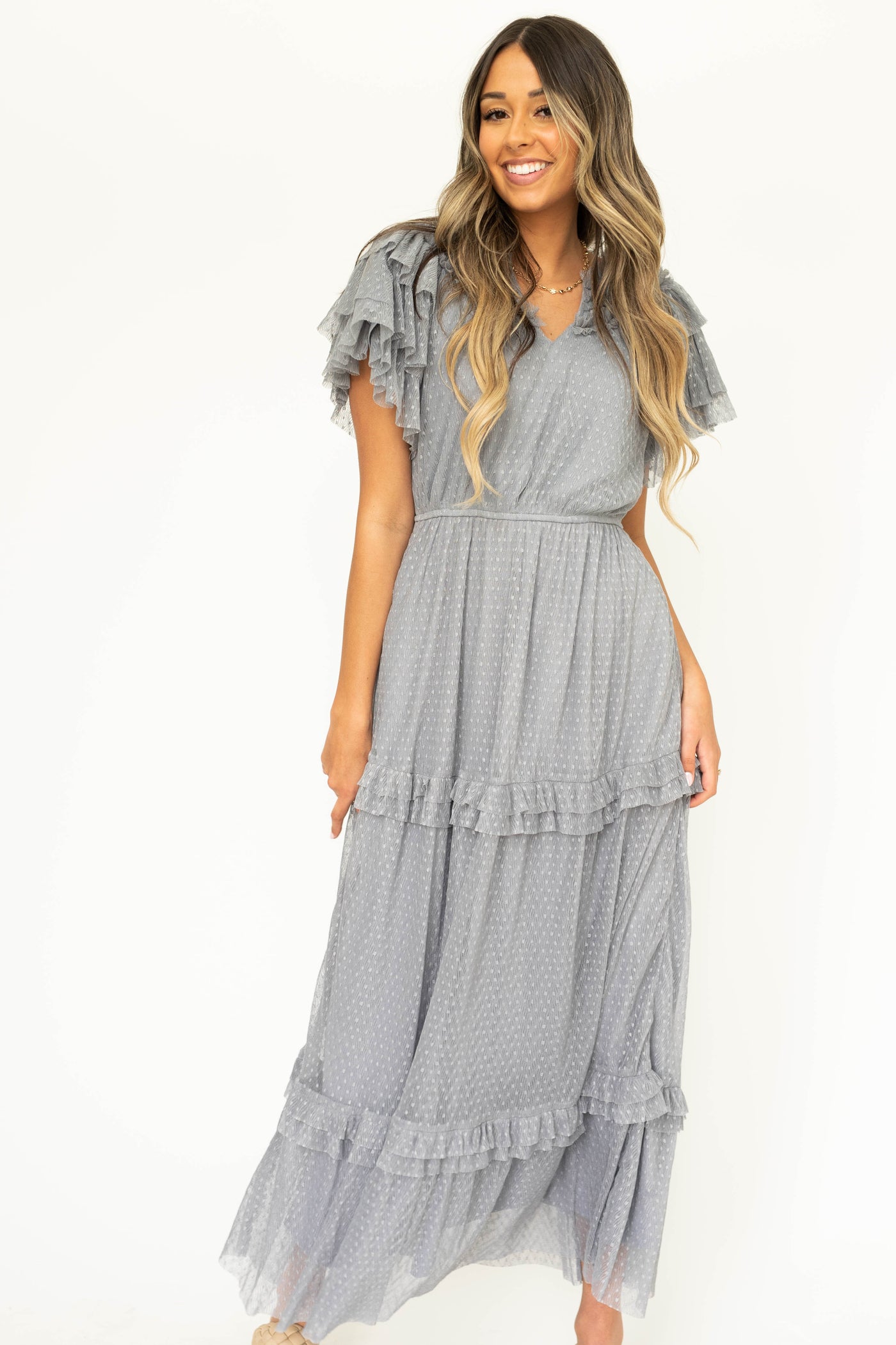 Blue gray lace short sleeve dress with ruffles on sleeves and neck.