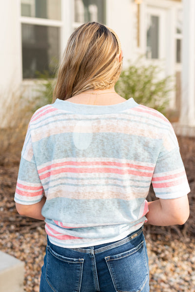 Back view of the blue v-neck stripe shirt