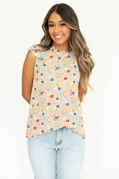 Front view of a taupe floral short sleeve top