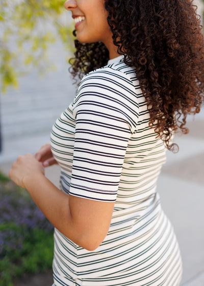 Side view of the black striped top