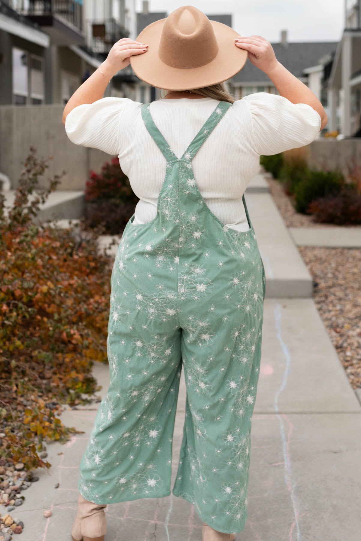 Back view of the plus size green embroidered overalls