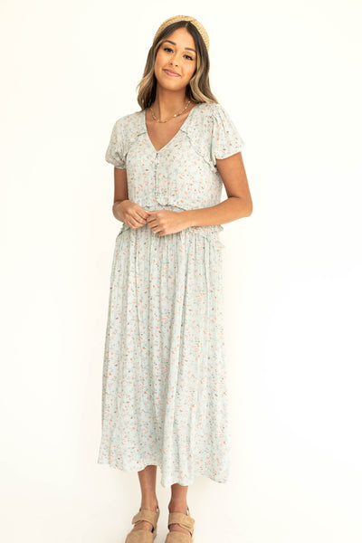 Front view of a light seafoam dress with short sleeves.