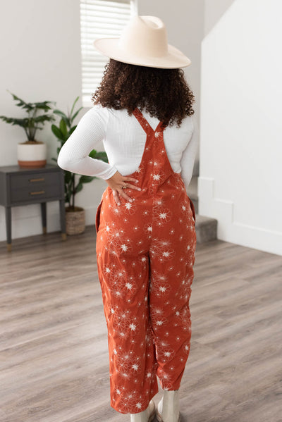Back view of the rust embroidered overalls