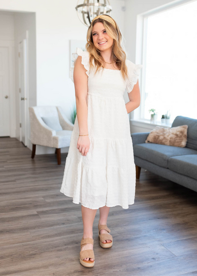 White textured dress with ruffle sleeves