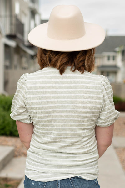 Back view of a sage stripe top