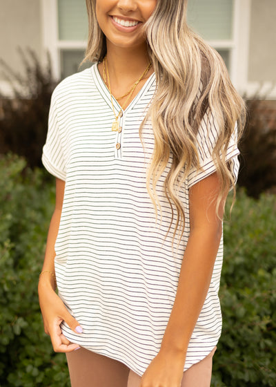 V-neck with button off white top with short sleeves