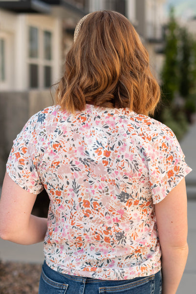 Back view of an ivory floral dress