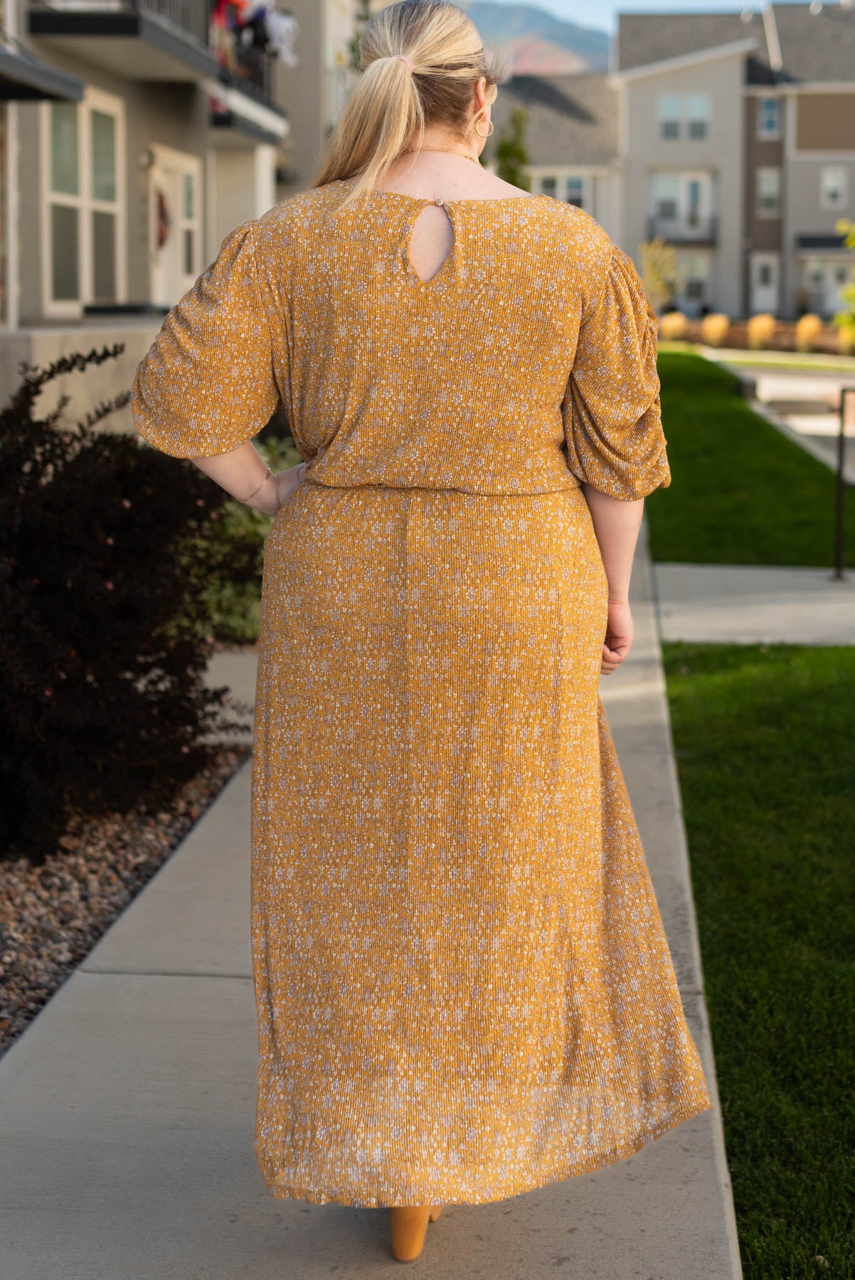 Back view of the plus size mustard dress