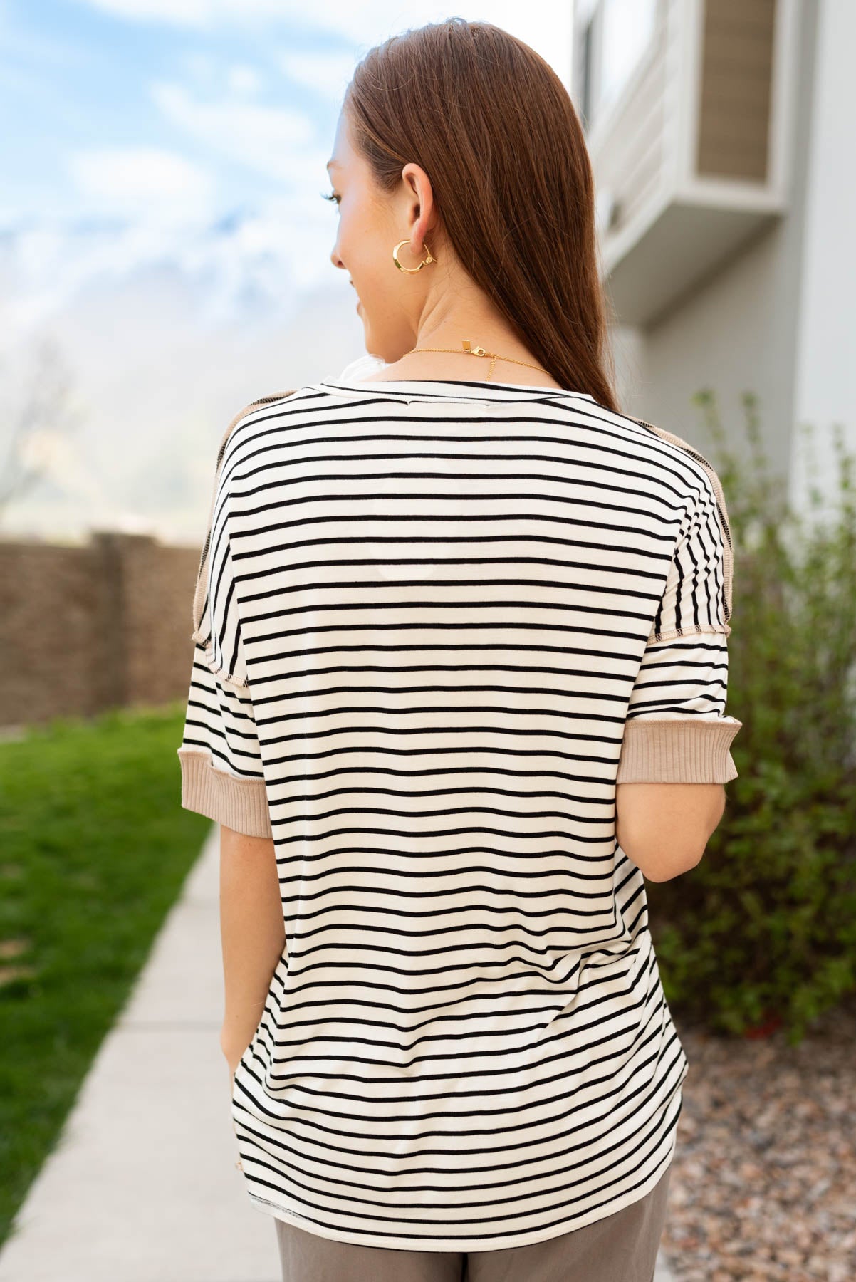 Back view of the taupe stripe block top