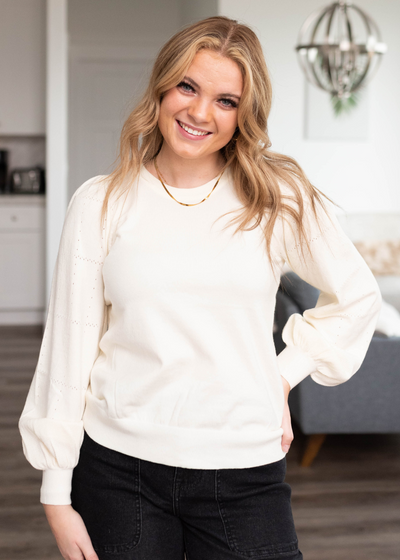 Close up of the ivory puff sleeve sweater