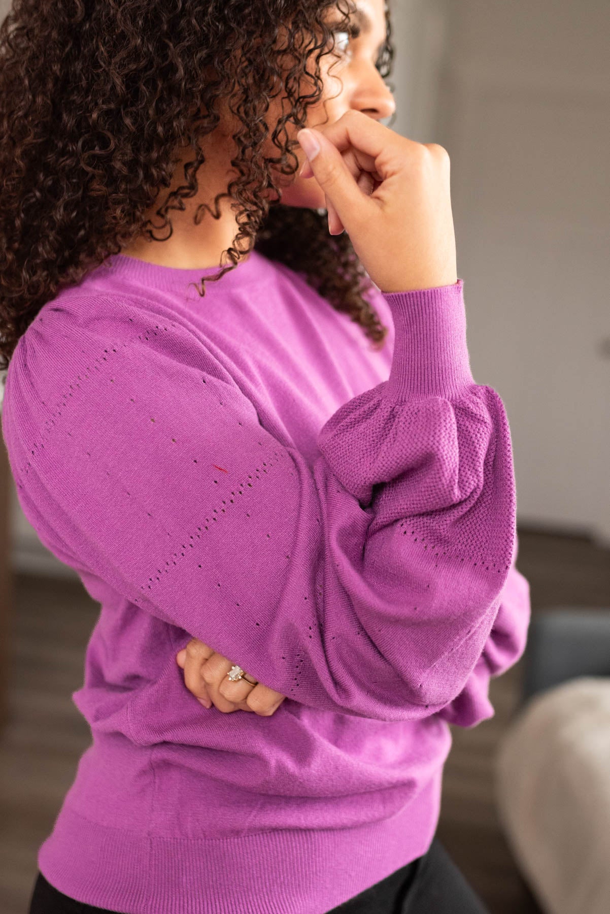 Side view of a mulberry puff sleeve sweater